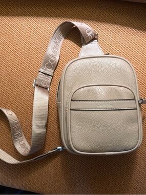 Calvin Klein Taupe Pebbled Leather Sling Bag with Branded Strap